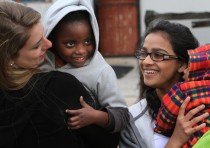 Nicole and Palak with kids at Philani